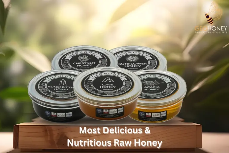 Various types of raw honey options displayed on a wooden surface with a jar of honey and flowers in the background.
